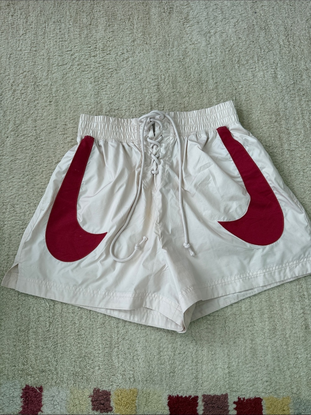 Nike Cream Women's Athletic Shorts with Red Swoosh Panels size small chest